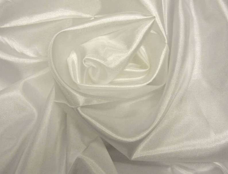 May include: White sheer fabric draped and folded to create a soft, flowing, and elegant design.