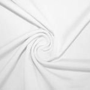 May include: A close-up of white fabric arranged in a spiral. The material is soft and smooth, with shadows and highlights that accentuate its texture and folds. The image conveys a sense of purity and simplicity, highlighting the fabric's delicate nature.