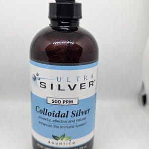 May include: A brown glass bottle of Ultra Silver Colloidal Silver with a black dropper. The label is white and blue, with text that reads "500 PPM" and "enhances the immune system". The bottle contains 8 fl oz (236 ml).