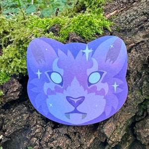 May include: A purple and blue cartoon animal face with white eyes and a white nose. The animal has a fluffy mane and a few white stars around its head.