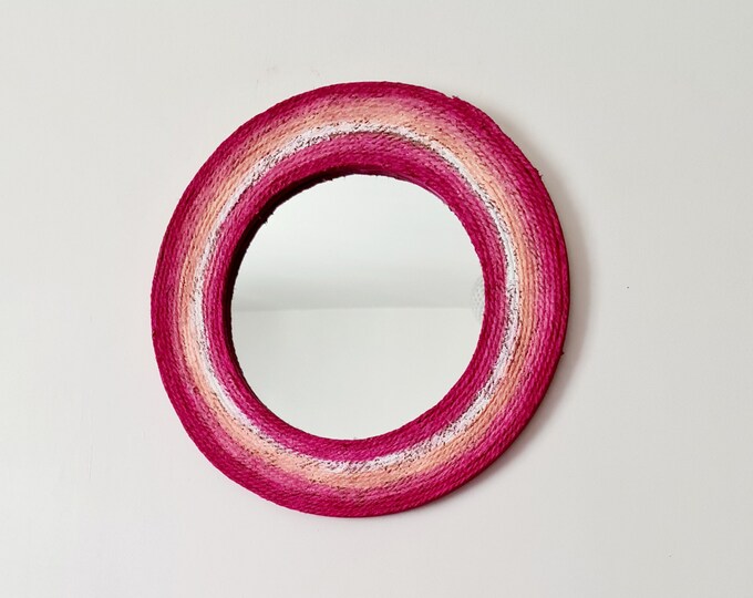 Pink round mirror