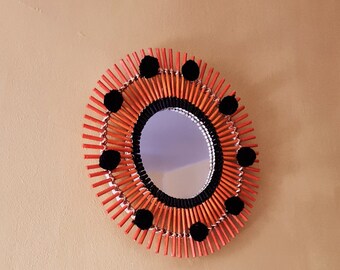 Orange rattan mirror