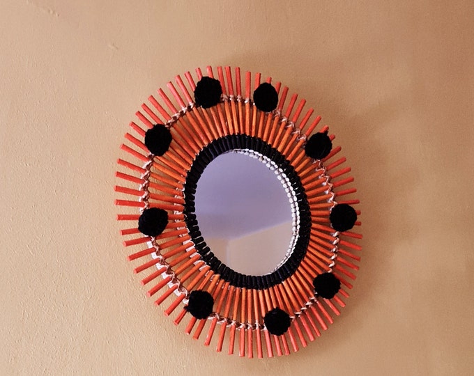 Orange rattan mirror