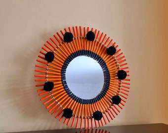 Orange rattan mirror