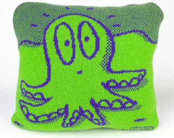 40cm knitted octopus cushion. Green & purple merino lambswool. Handmade in UK.