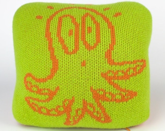 25cm knitted octopus cushion. Lime green & orange merino lambswool. Handmade in UK.