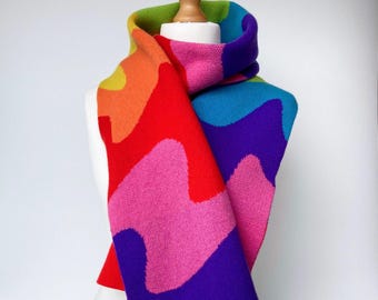 Pure merino wool knitted scarf with swirling rainbow stripes. Handmade by me in the UK. Made to order. 25 x 200cm / 10" x 80".