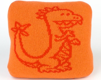 25cm knitted dinosaur cushion. Red & orange merino lambswool. Handmade in UK.