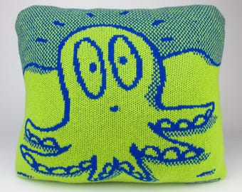 40cm knitted octopus cushion. Green & blue merino lambswool. Handmade in UK.