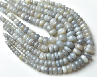 May include: A strand of gray moonstone beads, each bead is a smooth, rounded oval shape with a slight shimmer.