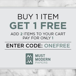 May include: A white and gray marble background with a white rectangle containing the text "BUY 1 ITEM GET 1 FREE" in black. Below the text is "ADD 2 ITEMS TO YOUR CART PAY FOR ONLY 1" in black. Below that is "ENTER CODE: ONEFREE" in black. The bottom of the rectangle contains a logo with the text "MUST MODERN PAPERS" in gray.