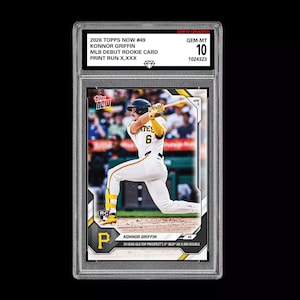 May include: A graded 2026 Topps Now baseball card featuring Konnor Griffin in a Pittsburgh Pirates uniform. The card is encased in a protective holder and is graded GEM-MT 10. Text includes "MLB Debut Rookie Card" and "Print Run X,XXX".