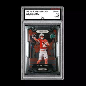 May include: A graded sports card featuring a football player in a red and white uniform throwing a football. The card is a 2024 Prizm Draft Picks card, number 192, featuring Arch Manning, a rated prospect. The card is graded GEM-MT 10 by a third-party grading company.