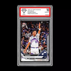 May include: A graded Ace Bailey rookie debut basketball card from the 2025-26 Topps Now series. The card features a photo of Bailey in a Utah Jazz uniform, with the number 19. The card is graded a 10 GEM-MT.
