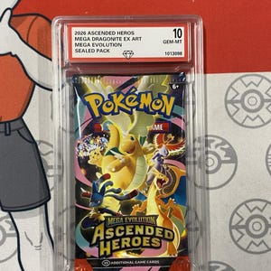 Puede incluir: Un paquete de cartas Pokémon sellado de la serie Mega Evolution Ascended Heroes, calificado como 10 GEM-MT. El paquete presenta un diseño colorido con varios personajes Pokémon y el texto "2026 Ascended Heros Mega Dragonite EX Art Mega Evolution Sealed Pack."