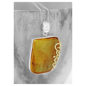 Orange Amber Sterling Silver Pendant: Gold Plated Swirl Design