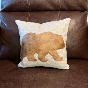 12x12 Bear Themed Throw Pillow tan colored upholstery weight material for front and back. The bear is cut from faux brown leather.