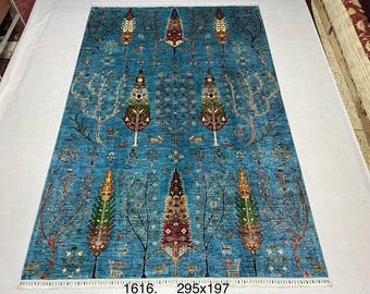 High-quality, extremely soft wool of sheep hand-knotted Afghan rug in design of three of life.