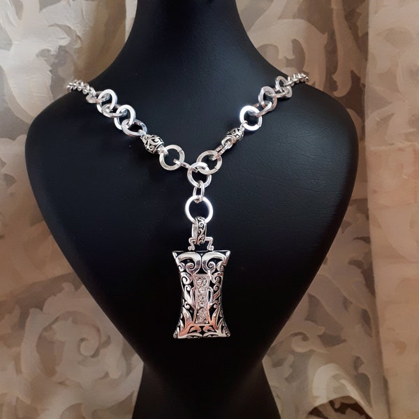 Fabulous silver tone pendant necklace. Gift idea