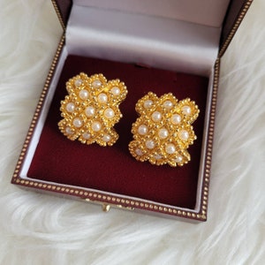 Vintage gold tone clip on earrings with faux pearls. Gift idea