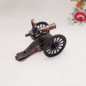 LCAN Cannon mounted on a wheeled chassis incorporating a pencil sharpener * 
