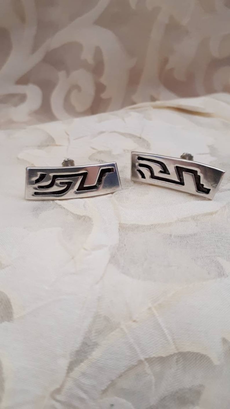 Designer piece. Hallmarked tribal aztec symbol screw back earrings Vintage 925 Mexican Taxco ATA oxidized sterling silver mayan symbol