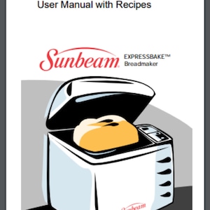 Op de afbeelding: Een witte Sunbeam EXPRESSBAKE broodbakmachine met een brood erin. Het deksel is open en de broodbakmachine staat op een grijs oppervlak.