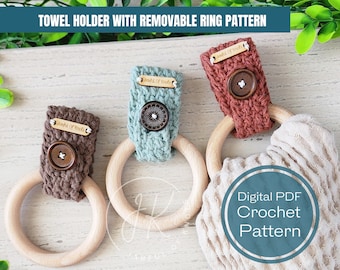 May include: Three crocheted towel rings in brown, green, and red with wooden rings. Each ring has a wooden tag that says "World of Knots". The rings are on a light wood surface with a beige towel. Digital PDF Crochet Pattern.