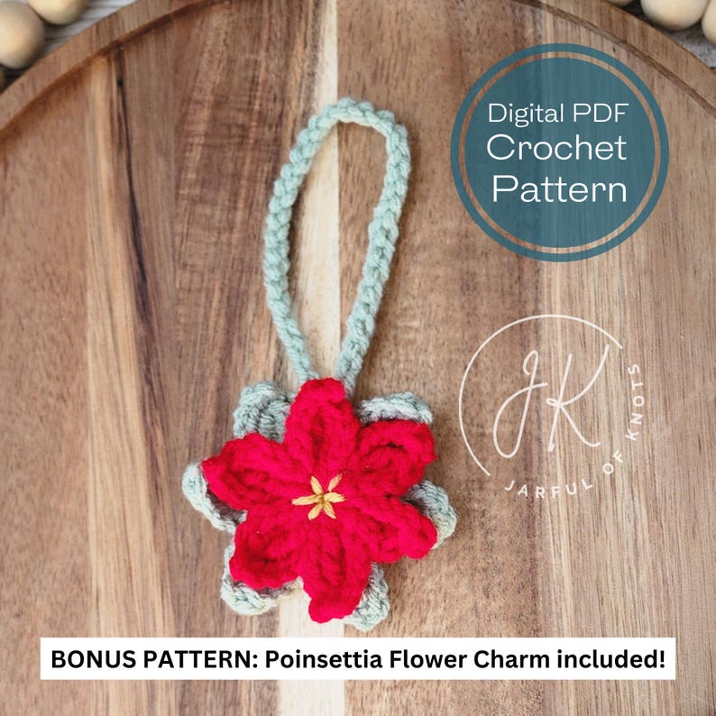 May include: A crochet pattern for a poinsettia flower ornament with a green loop for hanging. The pattern is a digital PDF download and includes a bonus pattern for a poinsettia flower charm. The text "Digital PDF Crochet Pattern" and "JARFUL OF KNOTS" is visible in the image.