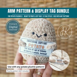 May include: A plush, beige potato with a smiling face and a sign that reads "EMOTIONAL SUPPORT POTATO." The image also includes a tag that says "POSITIVE POTATO." The text "ARM PATTERN & DISPLAY TAG BUNDLE" is at the top.