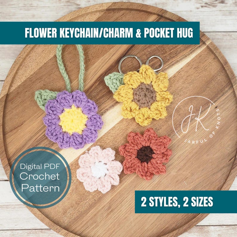 May include: Four crocheted flower keychains in different colors and styles. The flowers are purple, yellow, pink, and orange. The keychains are on a wooden surface. Digital PDF Crochet Pattern. 2 Styles, 2 Sizes.