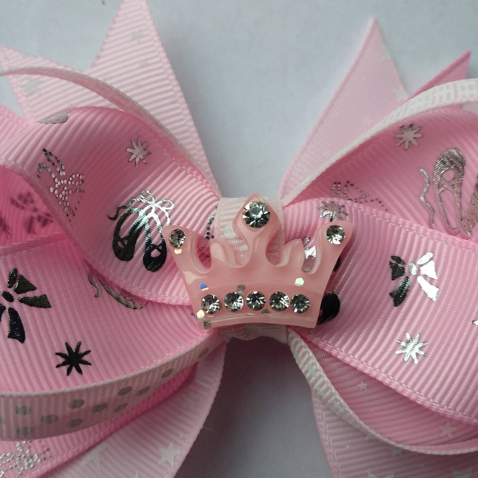large stacked pink and silver ballet hair bow with sparkly crown in the centre, perfect for ballerinas. large stacked pink and silver ballet hair bow with sparkly crown in the centre, perfect for ballerinas.