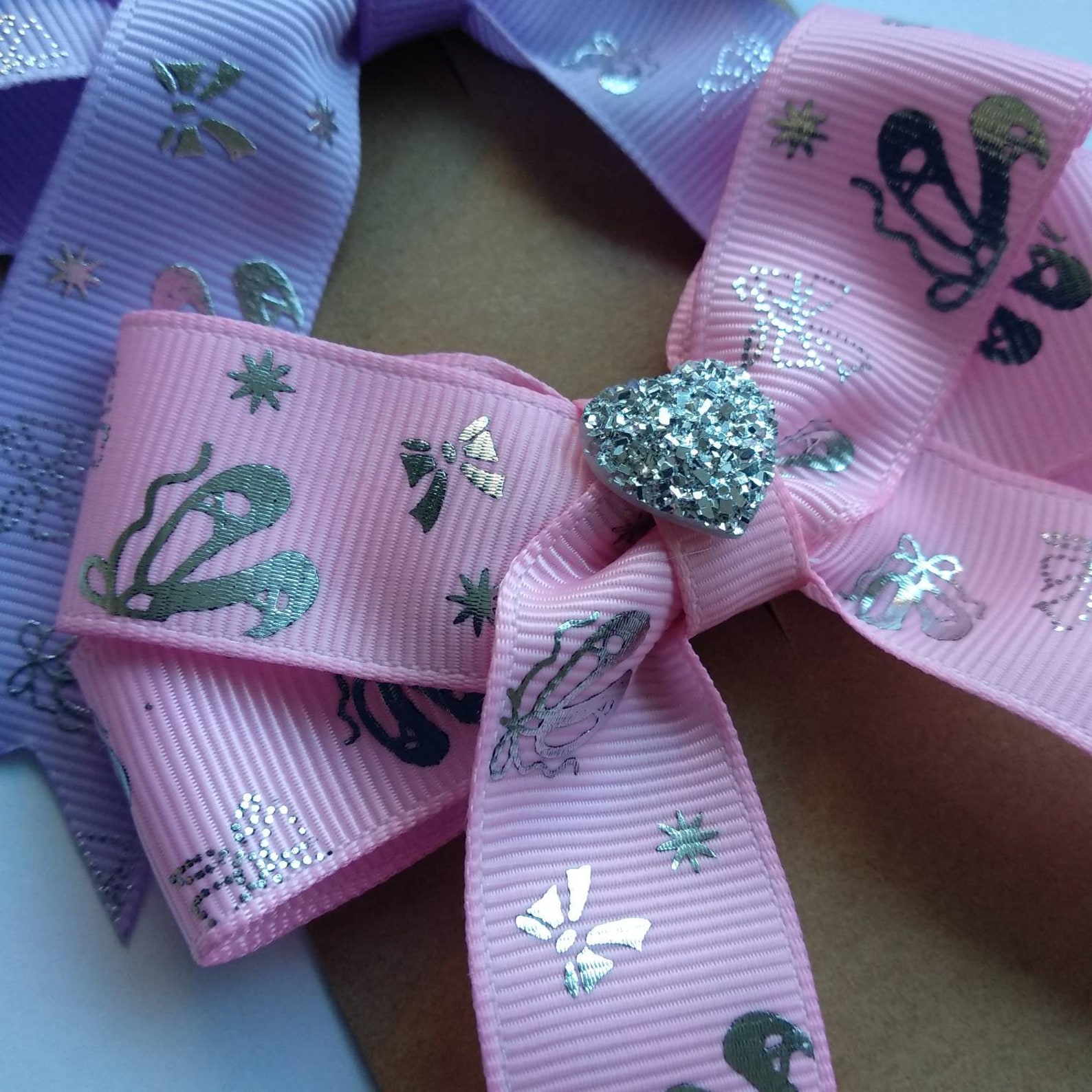 pack of 2 ballerina hair bows on clips or elastic, with silver ballet details and shiny heart centre. perfect gift for little da