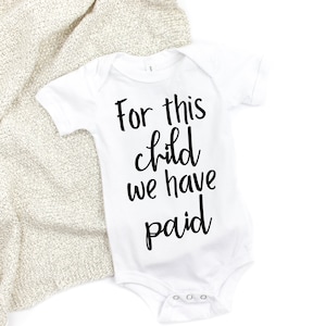 For this child we have PAID baby bodysuit, IVF and infertility baby clothes, pregnancy announcement, funny IVF baby bodysuit, shots