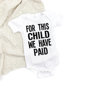 For this child we have PAID baby bodysuit, Pregnancy Reveal, Baby Announcement, funny IVF baby bodysuit, IVF and infertility baby clothes.
