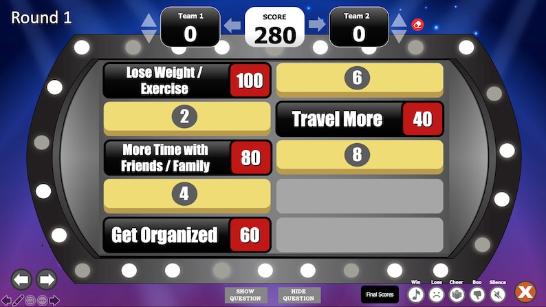 May include: A game show screen with a scoreboard showing Team 1 with 0 points and Team 2 with 0 points. The score is 280. The game show screen has four categories: Lose Weight/Exercise, More Time with Friends/Family, Travel More, and Get Organized. Each category has a number next to it, representing the number of points awarded for that category. The categories are in a grid format, with two categories per row.