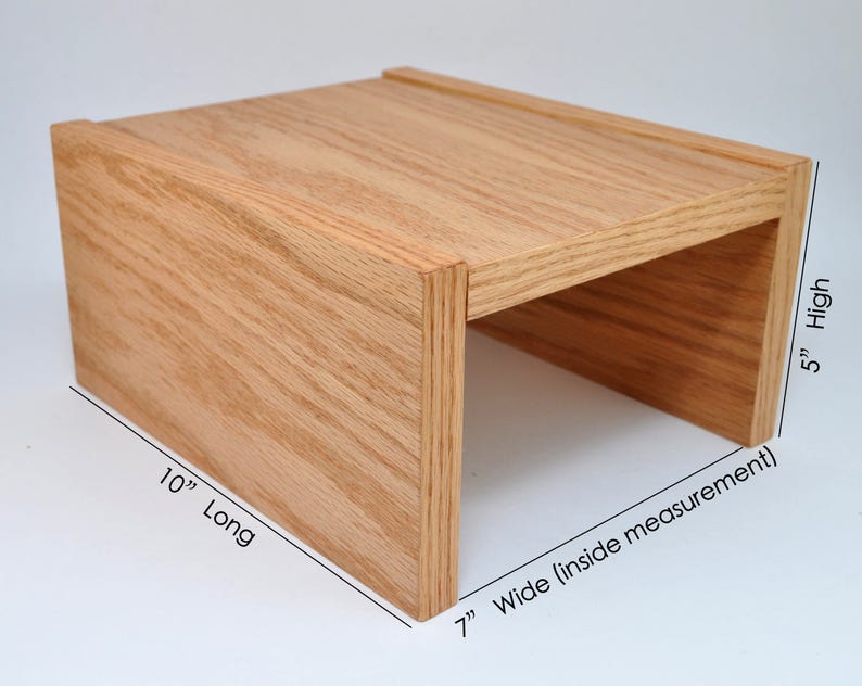 May include: A wooden shelf unit with a natural finish. The shelf is 10 inches long, 7 inches wide (inside measurement), and 5 inches high.