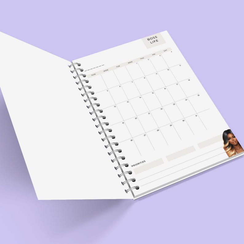 May include: An open white planner with a monthly calendar and the words "Boss Life" at the top. The planner has a spiral binding and a blank page on the left side. The right side of the planner has a calendar with the days of the week labelled. There is a section for priorities at the bottom of the page. A woman with long, dark hair is pictured in the bottom right corner.