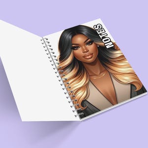 May include: A spiral bound notebook featuring a colourful illustration of a woman with long black and blonde hair. The cover reads "NOTES" in bold black lettering.