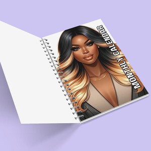 May include: A spiral bound monthly calendar featuring a black and blonde illustration of a woman on the cover. The text "MONTHLY CALENDAR" is printed vertically on the right side of the cover.