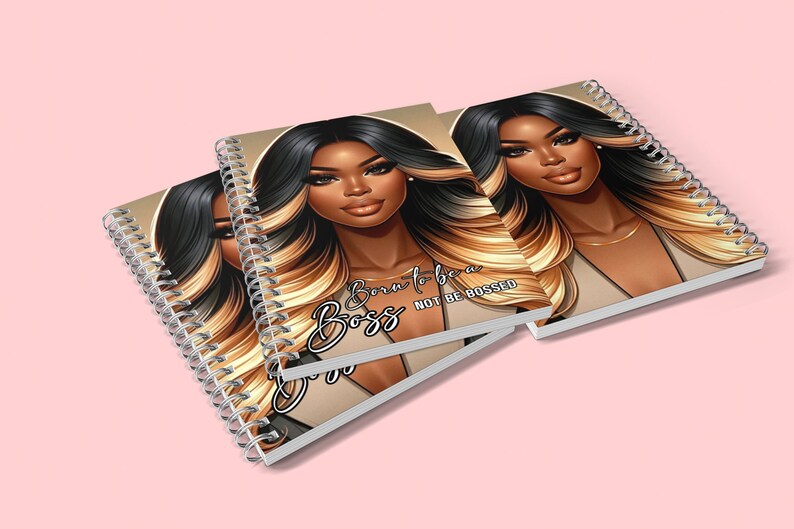 May include: Three spiral bound notebooks with a brown background and a black and blonde illustration of a woman. The text on the notebook reads "Born to be a Boss, Not be Bossed".