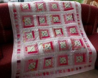 High-quality unique quilt made of designer quality fabrics, red, blue, green, etc., lovingly color coordinated, finely stitched