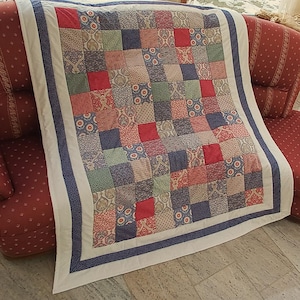 High-quality unique patchwork quilt made of designer quality fabrics, lovingly color coordinated, finely stitched