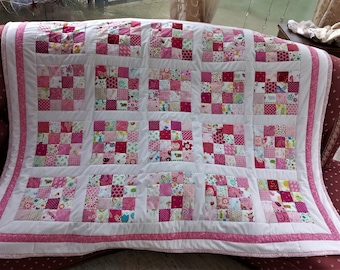 High-quality unique quilt made of designer quality fabrics, red, blue, green, etc., lovingly color coordinated, finely stitched