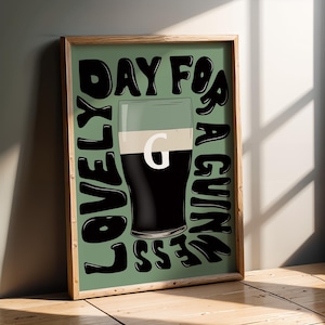 May include: A green and black poster with the text "Lovely Day For A Guinness" and a graphic of a glass of Guinness.