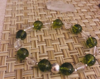 Quartz , sterling silver , peridot - positive energy - helps people with tramatic emotional situations -communication -