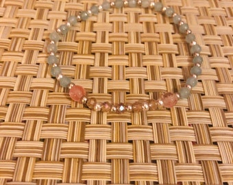 A stone of courage, calming, reduces stress, quiets the mind , invokes tolerance of others - Aquamarine , cherry quartz , crystal