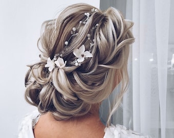 Bloemen bruiloft haarrank: witte bloem en parel bruids hoofddeksel