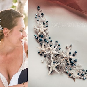 May include: A silver hair comb featuring white starfish and dark blue beads. The comb is adorned with crystal accents and is ideal for a beach wedding or a nautical themed event.