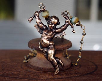 French Brass Cherub Cupid Necklace with Pyrite Chain and Sky Blue Beads